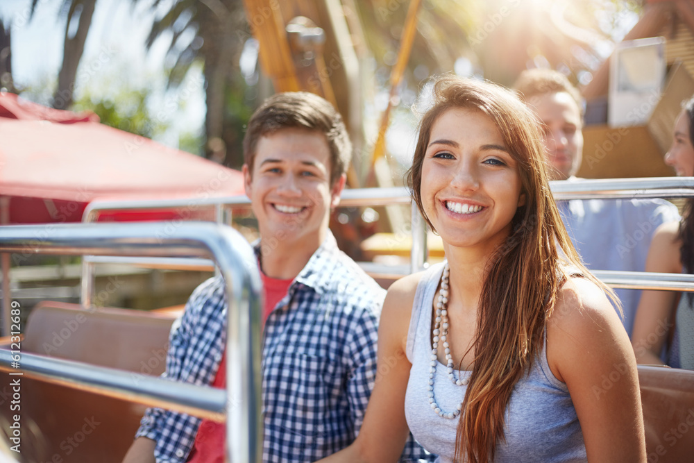 Portrait smiling young couple on amusement park ride