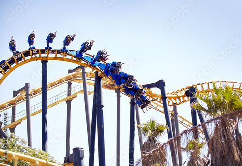 Photography People flipping upside-down on amusement park ride