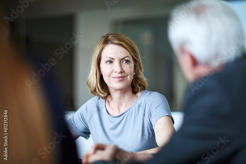 Businesswoman listening to businessman in meeting