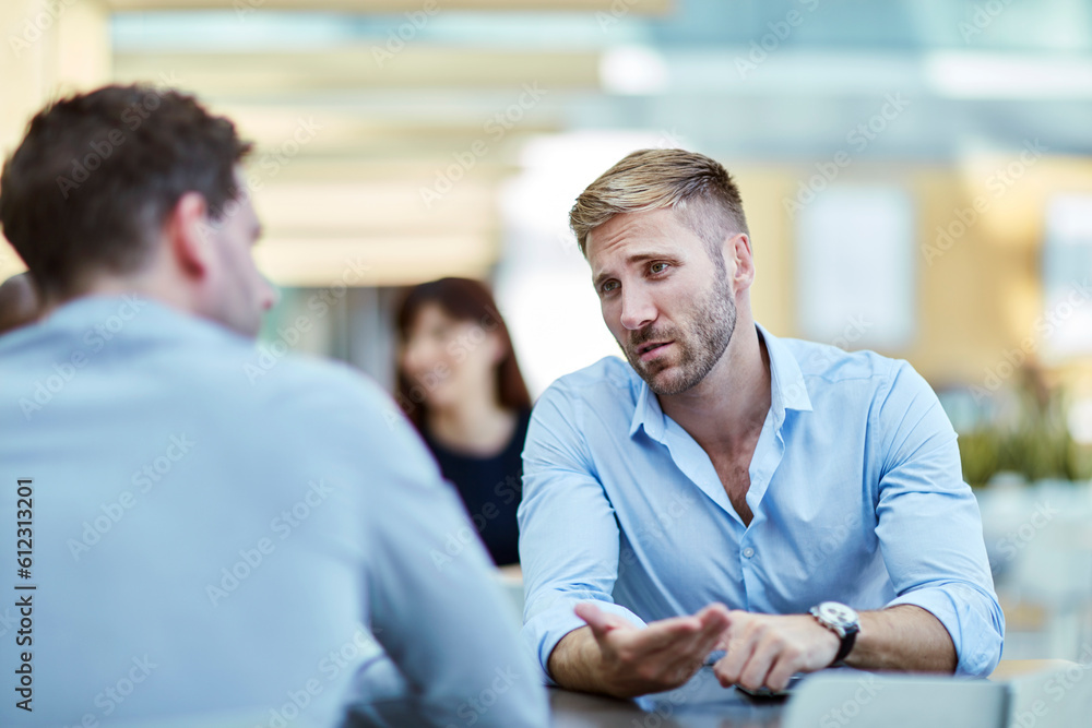 Businessman gesturing and talking to colleague Businessman gesturing and talking to colleague