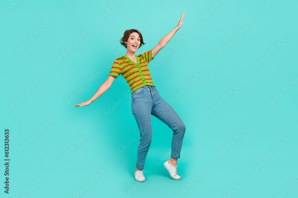 Full body photo of nice cheerful lady enjoy dancing good mood isolated on teal color background