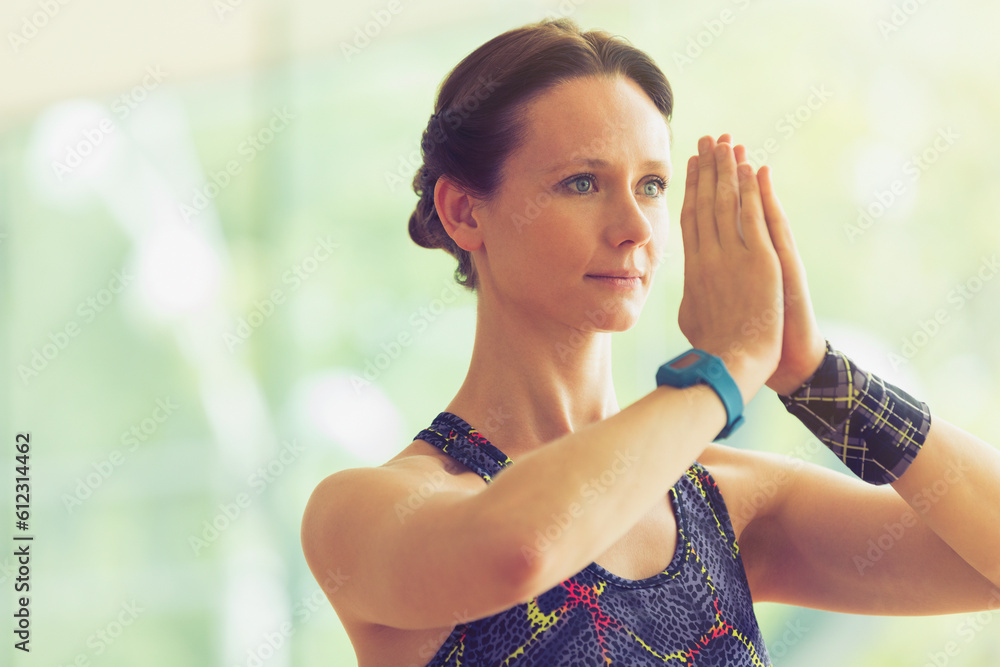 Calm woman with hands at prayer position in yoga class Calm woman with hands at prayer position in yoga class