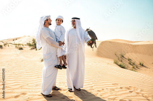 Three generation family making a safari in the desert of Dubai photo