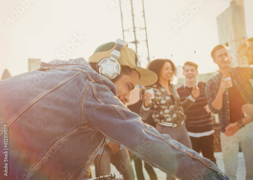 DJ with headphones at rooftop party