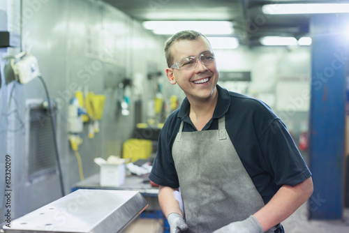Smiling worker in steel factory Free Download Smiling worker in steel factory - GFXLoad