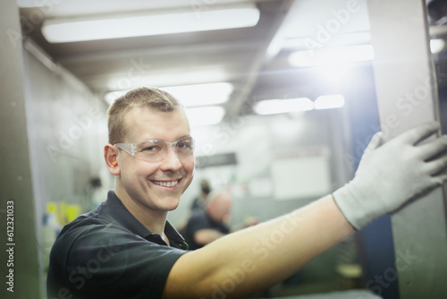 Portrait smiling worker in steel factory © KOTO