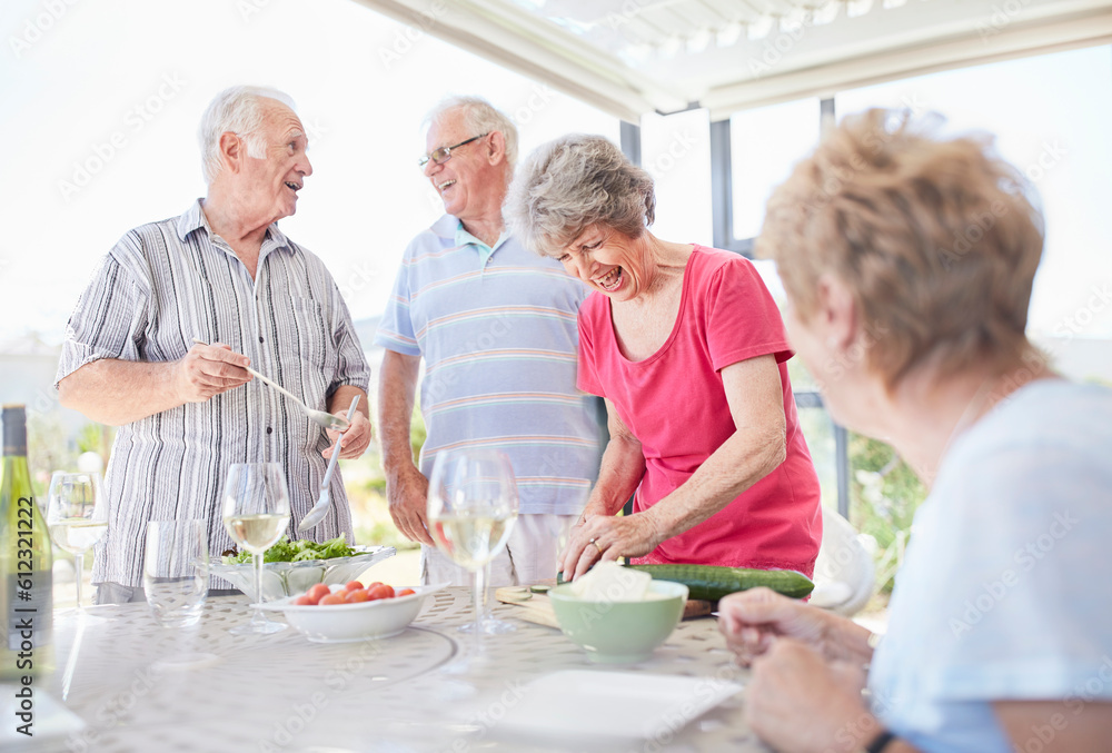 Senior couples preparing patio lunch Senior couples preparing patio lunch