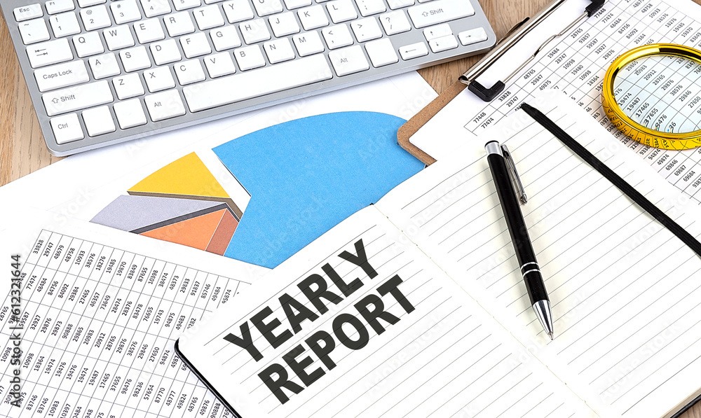 EARLY REPORT text on notebook with chart and keyboard EARLY REPORT text on notebook with chart and keyboard