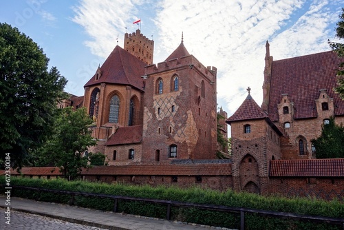 Malbork castle in Poland with fortification in backlight at sunset