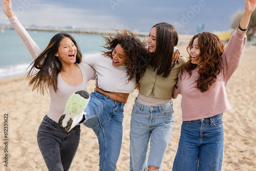 group multiracial female friends beach, happy students on vacation on mediterranean beach © PintoArt