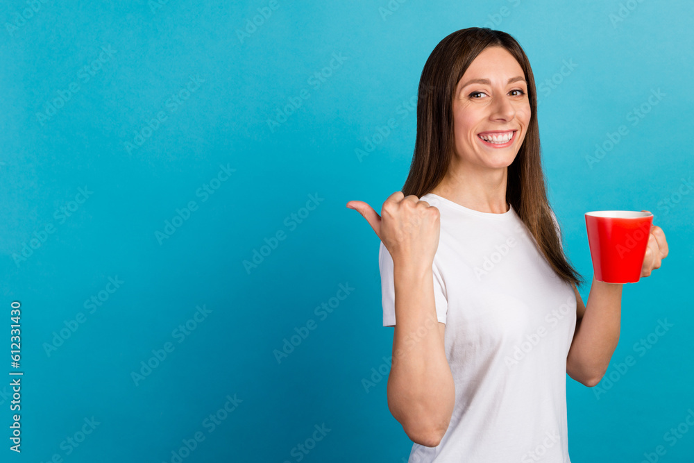 Close-up portrait of attractive cheery girl holding drinking latte pointing isolated on vivid shine blue color background Close-up portrait of attractive cheery girl holding drinking latte pointing isolated on vivid shine blue color background