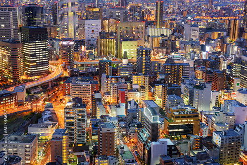 Osaka  Japan cityscape with dense architecture in the Umeda District at night.