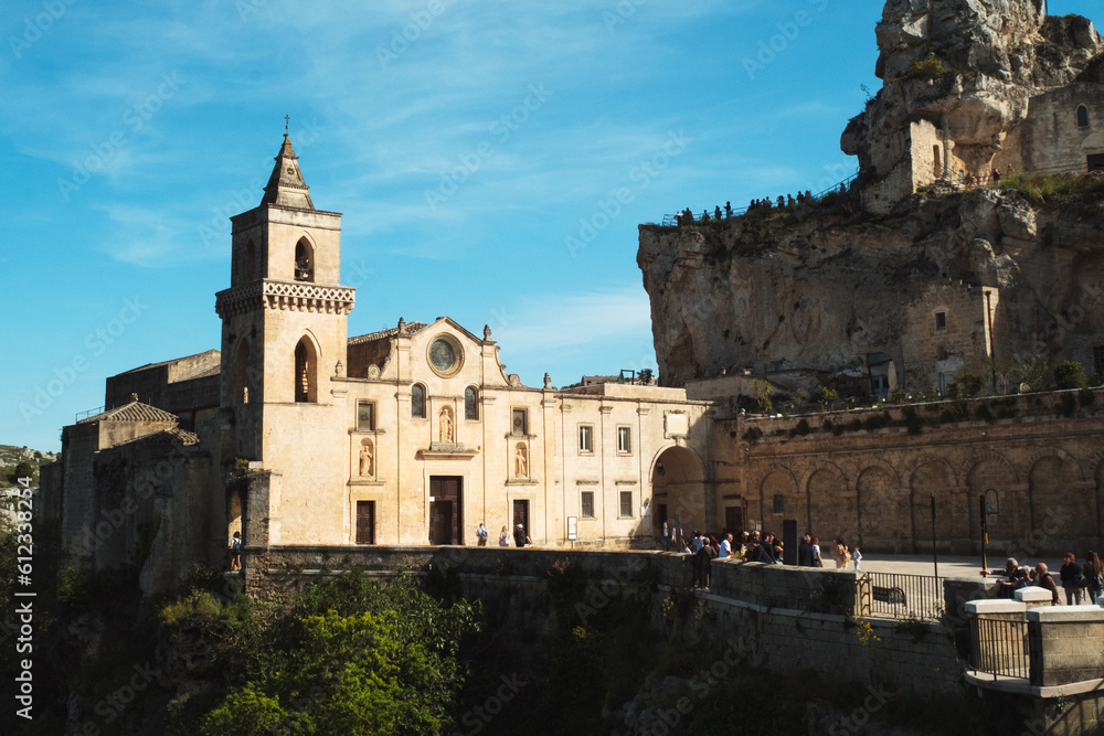 Panoramic city view with unique cave church exterior on old street of Matera Italy jewel of Basilicata - cave dwelling Sassi di Matera