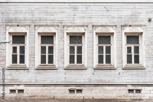 facade with windows of an old house. old village house