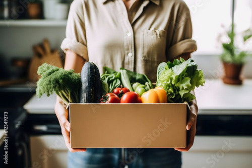Nutritious Vegetable Delivery: Woman Receives Box of Fresh Groceries
