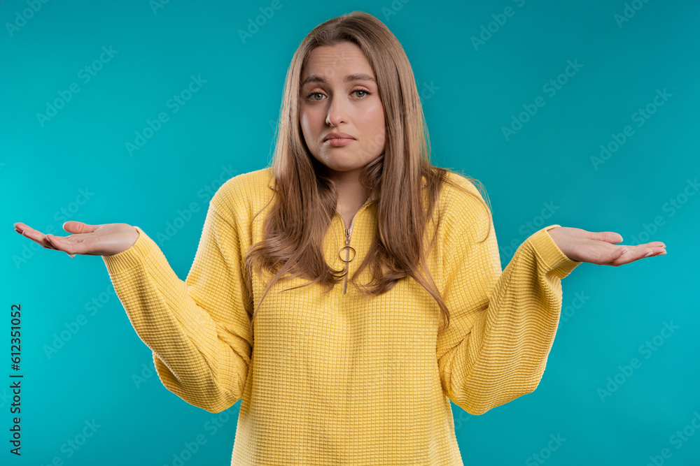 Confused pretty woman, shoulders up - can't help, makes gesture of I dont know Confused pretty woman, shoulders up - can't help, makes gesture of I dont know