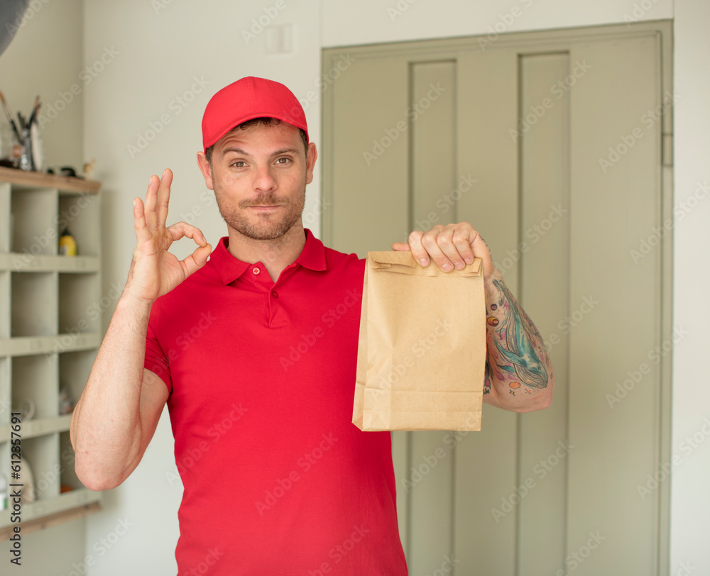 feeling happy, showing approval with okay gesture. delivery take away concept feeling happy, showing approval with okay gesture. delivery take away concept