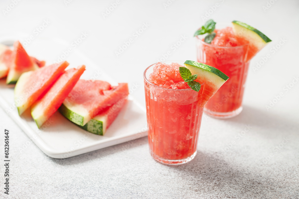 Refreshing cold summer drink watermelon slushie with mint in glass Refreshing cold summer drink watermelon slushie with mint in glass