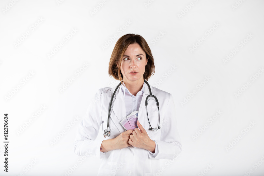 Close-up photo of cunning female doctor hiding pack of cash money in her medical gown isolated on white background. Bribe concept Close-up photo of cunning female doctor hiding pack of cash money in her medical gown isolated on white background. Bribe concept