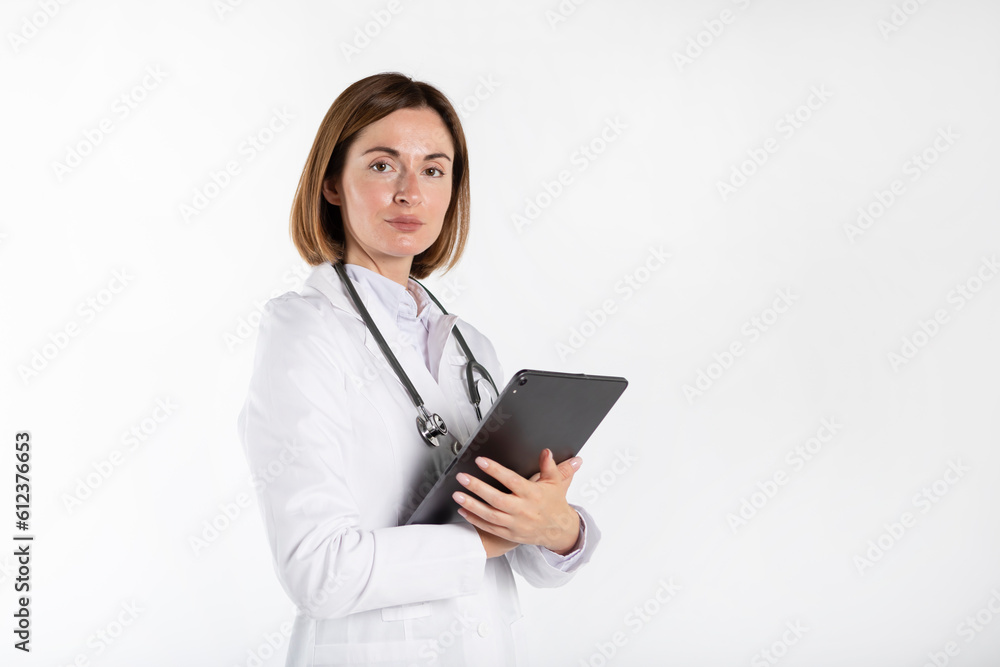 Young attractive female doctor standing with crossed arms and smiling isolated on white background Young attractive female doctor standing with crossed arms and smiling isolated on white background