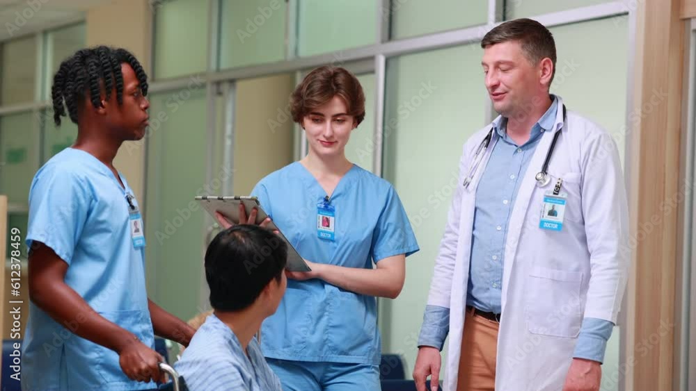 Diverse group of young students doctors standing together and consulting caucasian teacher doctor in a hospital corridor. Medicine medical and health care concept Diverse group of young students doctors standing together and consulting caucasian teacher doctor in a hospital corridor. Medicine medical and health care concept