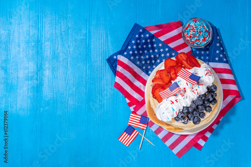 Holiday 4th of July breakfast pancakes, battercakes with whipped cream and berries like american flag. Homemade Patriotic sweet brunch or snack food, idea for party treat and desserts photo