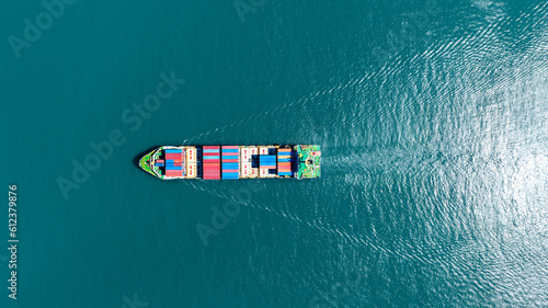 Cargo container Ship, cargo maritime ship with contrail in the ocean ship carrying container and running for export concept technology freight shipping sea freight by Express Ship. top view