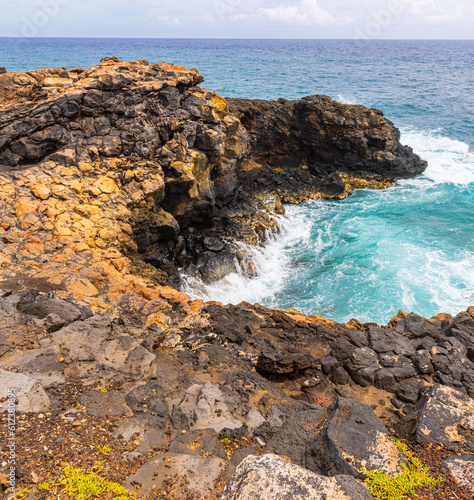 Waves Washing Over The Volcanic Shoreline of Keoneloa Bay, Keoneloa Bay Trail, Poipu, Koloa, Kauai, Hawaii, USA photo