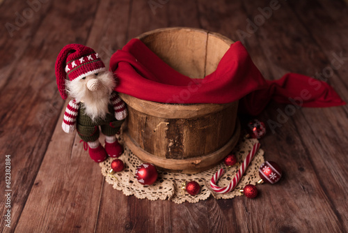 Christmas background for a newborn. A barrel with a decor for a child.New Year's decor.Natural wood.