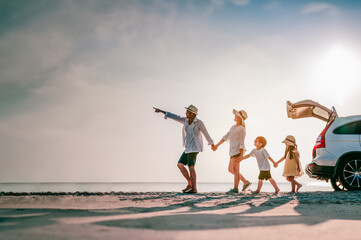 Happy father, mother and son enjoying road trip the summer holidays.