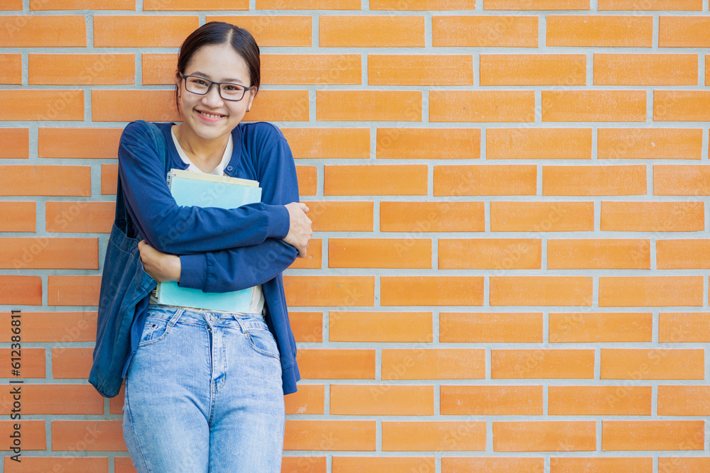 Cute smiling laugh shy Asian university teen girl student education in university candid shot. Cute smiling laugh shy Asian university teen girl student education in university candid shot.