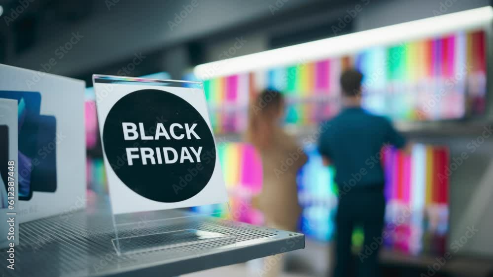Home Electronics Store's Customers Hunting for TV Deals During Black Friday Event Savings. Knowledgeable Staff Worker Aids Young Multiethnic Female with Choosing a Modern Television Home Electronics Store's Customers Hunting for TV Deals During Black Friday Event Savings. Knowledgeable Staff Worker Aids Young Multiethnic Female with Choosing a Modern Television
