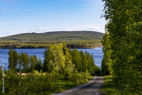 Kalvträsk, Sweden A mountainous landscape with a lake and forests