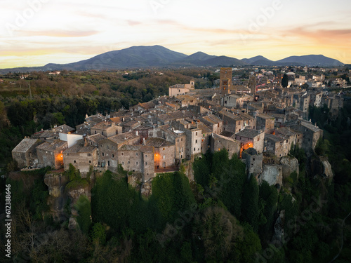 View from above, stunning aerial view of the village of Vitorchiano at sunset. Vitorchiano is a medieval Italian village in Viterbo Province, Lazio, Italy.. photo