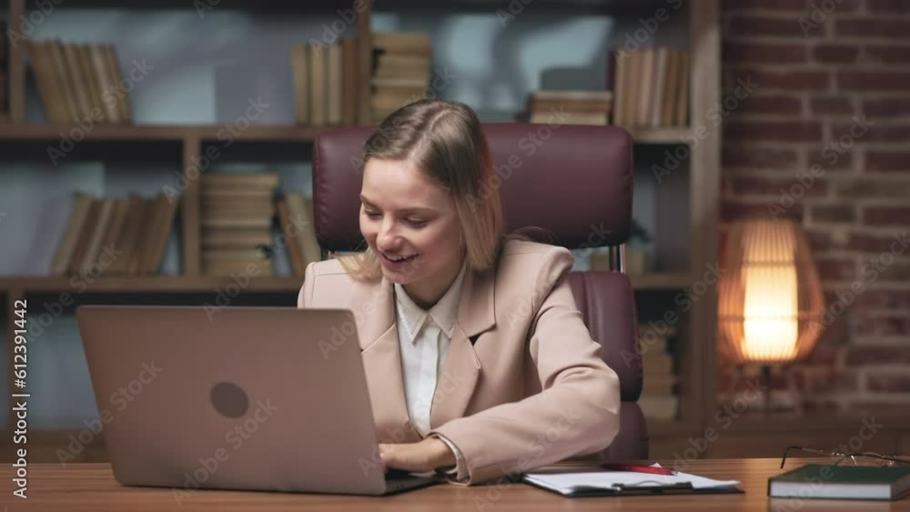 Excited caucasian woman emotionally celebrating success using laptop in cozy working space. Overjoyed female sitting at office desk, screaming wow and starting typing on computer. Excited caucasian woman emotionally celebrating success using laptop in cozy working space. Overjoyed female sitting at office desk, screaming wow and starting typing on computer.