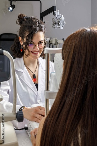 Doctor looking at patient smiling in clinic