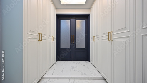 Luxurious entrance hall decorated with wainscoting porcelain tiles photo