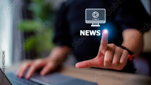 Women hand presses the play button with the news text. Broadcasting, publishing, or watching the latest news concept.