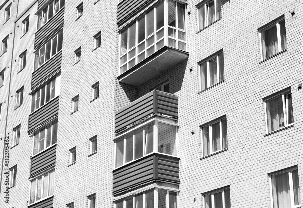 Architectural design of apartment buildings colorless. External view of a new building, residential building, apartments black and white. Modern houses, apartments.Facade of a high-rise apartment Architectural design of apartment buildings colorless. External view of a new building, residential building, apartments black and white. Modern houses, apartments.Facade of a high-rise apartment