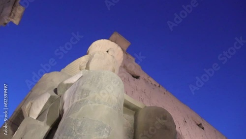 Colossal statue of Ramesses II at the entrance of Luxor Temple, Egypt.   photo