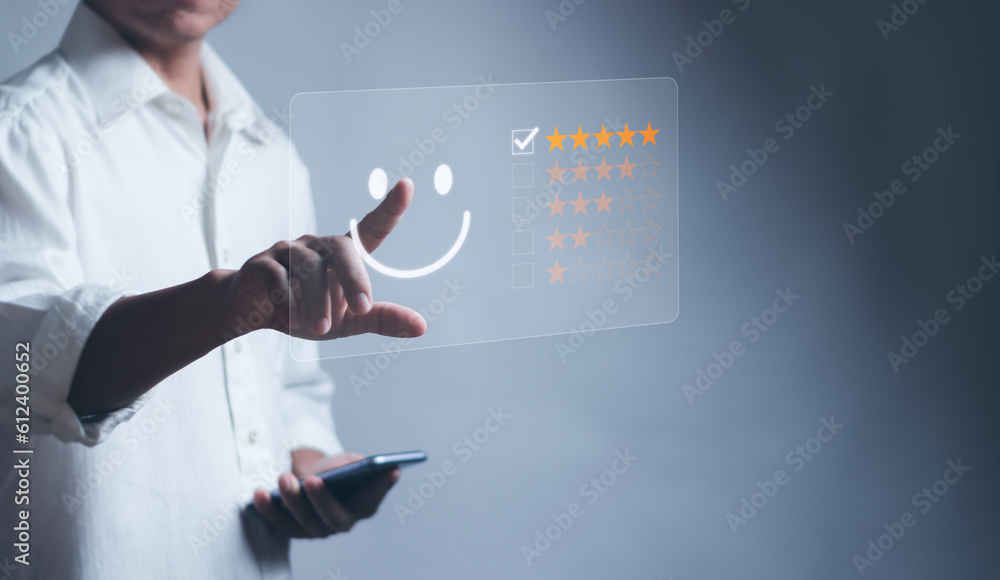 concept of satisfaction and customer service ,Man touching emoticons, smiley faces and stars on virtual screen Show excellent experience, highest satisfied from receiving good service concept of satisfaction and customer service ,Man touching emoticons, smiley faces and stars on virtual screen Show excellent experience, highest satisfied from receiving good service