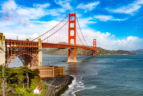 Panoramic Golden Gate of San Francisco in the state of California, USA under a beautiful blue sky and ocean. Seen from the viewpoint of the Californian city's waterfront. American bridge concept.