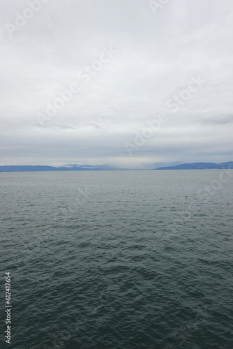 Panorama of Bodensee lake and a yacht, the view from Romanshorn, Switzerland