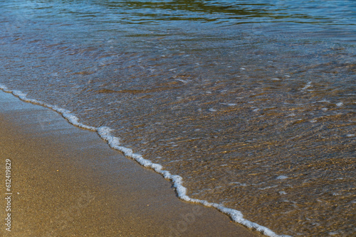 Sand and sea water on the beach in Angra do Reis  in Rio de Janeiro. Sunny day in the morning. Close-up