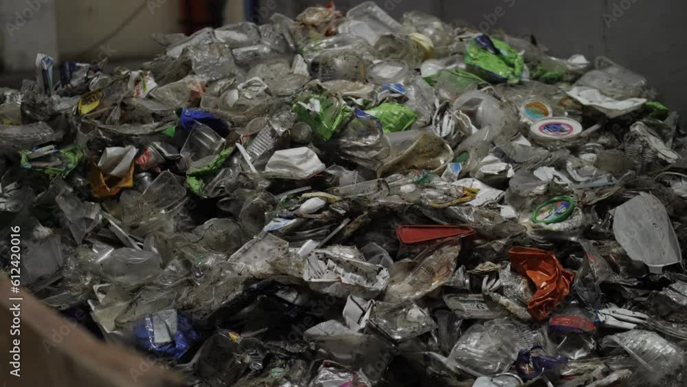 Garbage Recycling Factory, Plastic cubes for recycle Plant, Bales of pressed boxes, rubbish warehouse collection. Preparation of recyclables for recycling, Plastic city garbage. Garbage Recycling Factory, Plastic cubes for recycle Plant, Bales of pressed boxes, rubbish warehouse collection. Preparation of recyclables for recycling, Plastic city garbage.