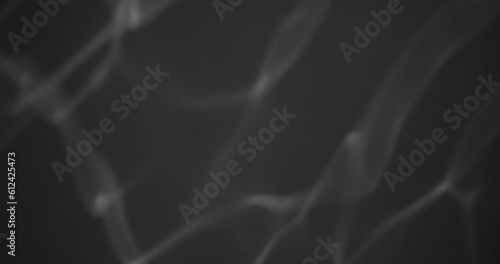 moving light reflections, glittering lights from water surface on black wall