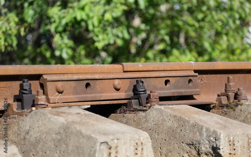 The place of connection of the rails with the help of a screwed lining The place of connection of the rails with the help of a screwed lining
