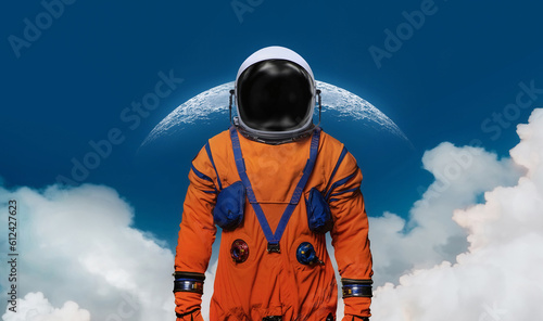 Astronaut stand on blue background with Moon and clouds. Collage with spaceman and Moon in blue sky. Sci-fi wallpaper. Elements of this image furnished by NASA © dimazel
