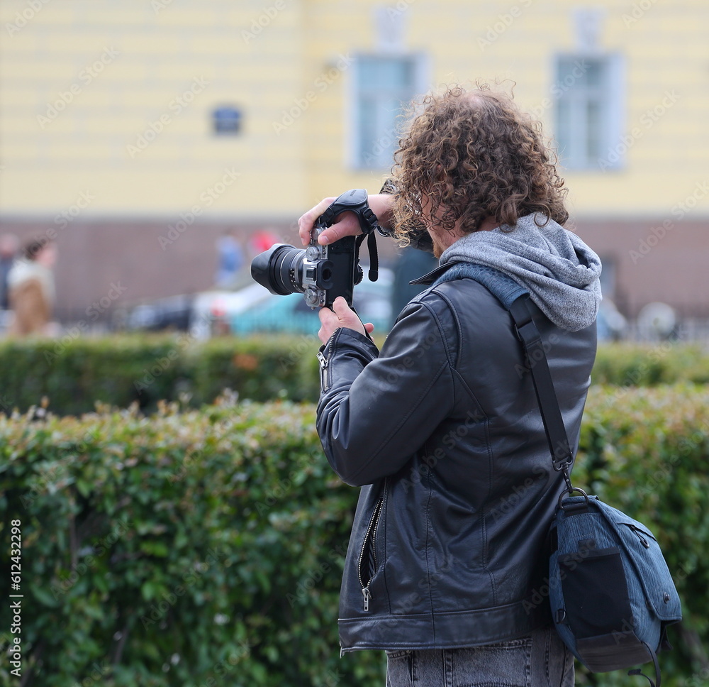 Photographer with a camera on the street, Nevsky Prospekt, Saint Petersburg, Russia, June 09 2023 Photographer with a camera on the street, Nevsky Prospekt, Saint Petersburg, Russia, June 09 2023