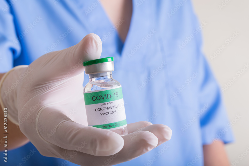 Doctors holding a bottle of covid-19 Coronavirus Doctors holding a bottle of covid-19 Coronavirus